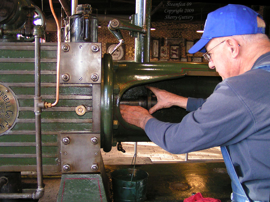 Watt Campbell "Corliss" engine - checking and lubing the rod packing.  Soule Live Steam Festival Meridian, MS 2009
